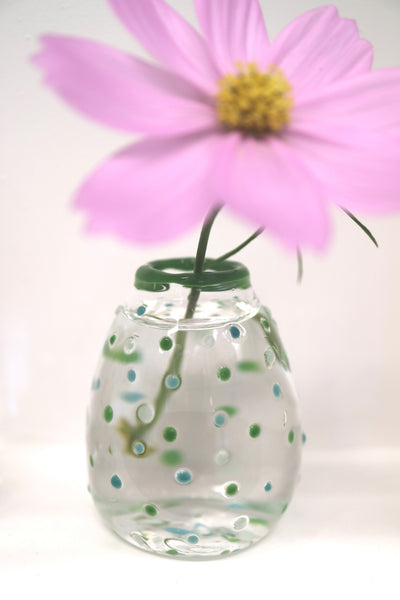 green blue polka dot vase on display
