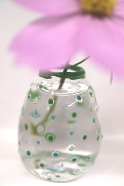 green bud vase on close up
