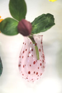displaying pink wall vase on a wall 